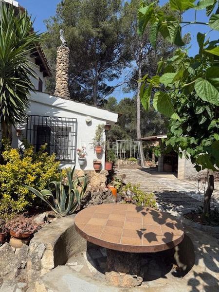 Foto f1aa2c5f-a1db-4d20-a206-565f62f88c69. Casa atención! fantástica oportunidad de adquirir un chalet rústico con encanto en la prestigiosa urbanización mas del plata de cabra d en Cabra del Camp