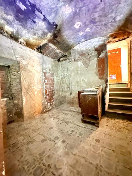 Foto 7dba6130-dbf6-4fce-813b-4f3456f43d0e. Masía casa de piedra para restaurar con garaje y patio en pleno centro del pueblo en Calonge