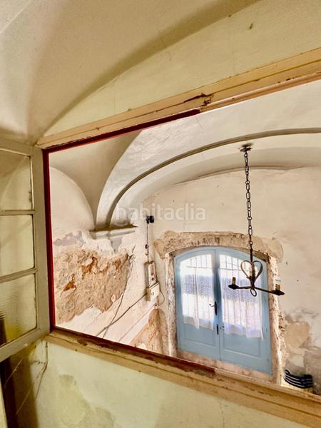 Foto e6e33f32-638a-4987-b8b7-247528e7fb61. Masía casa de piedra para restaurar con garaje y patio en pleno centro del pueblo en Calonge