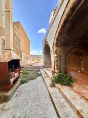 Masia a Poble. Calonge casa de piedra para restaurar con garaje y patio en plen