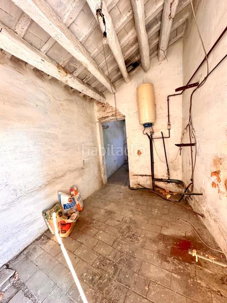 Foto 44536f6c-6499-4fa6-9846-7403b1da0a19. Masía casa de piedra para restaurar con garaje y patio en pleno centro del pueblo en Calonge