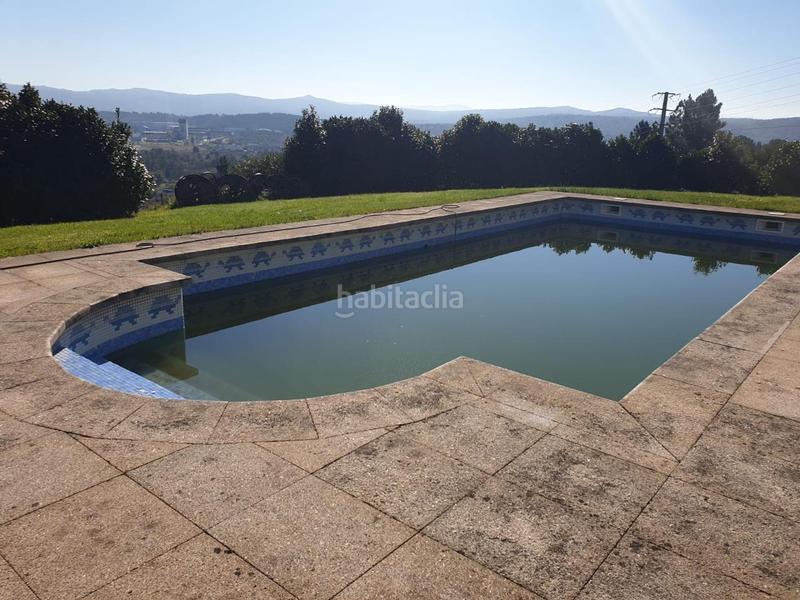 Foto bf8b56f5-068d-407c-a716-61e8d5b2b48a. Casa amb calefacció aparcament piscina a Ventiun Ourense