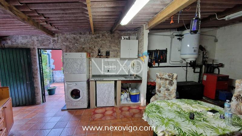 Foto af6dc4b0-bacd-42f7-bbc5-47254405a826. Haus mit heizung parking pool in Aldán Cangas