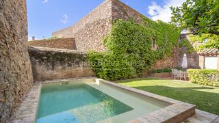 Masia  Carrer castellar. Casa de piedra rehabilitada en venta en gualta con piscina, jard