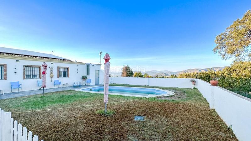 Foto c406d40d-0bfa-4551-af22-5bb40bb6bc8c. Chalet in partida dehesilla 80 in Centro Alhaurín el Grande