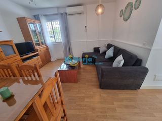 Appartement à Centro. Apartamento 1 dormitorio en planta baja con piscina y parking co
