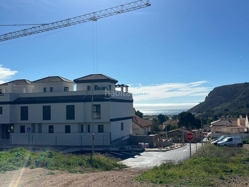 Foto c4cecaec-7e57-4318-8e42-cff5b503aa80. Casa adossada amb aparcament piscina a Portmán Unión (La)