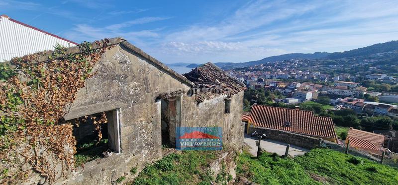 Foto f4e24d86-0f7a-496b-b8a9-51326ec9f6cb. Semi detached house in Bueu