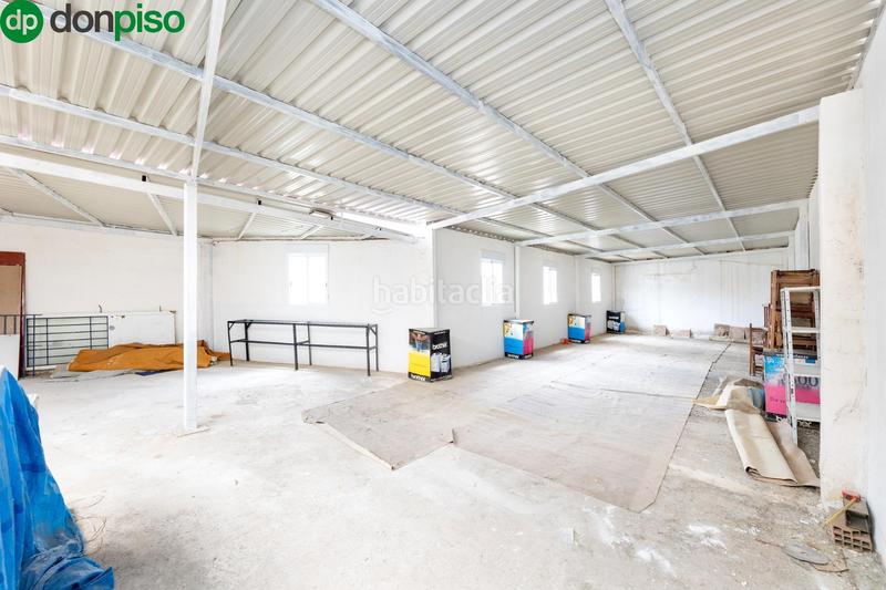 Foto f8b510e7-f842-4ec3-8bc1-ed49f1073031. Fabrikhalle mit heizung in Atarfe