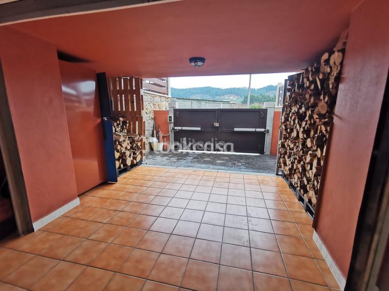 Foto 8bc2ec9c-f1a0-44ba-96bf-773c4c42a518. Xalet amb xemeneia calefacció aparcament a Dorrón Sanxenxo