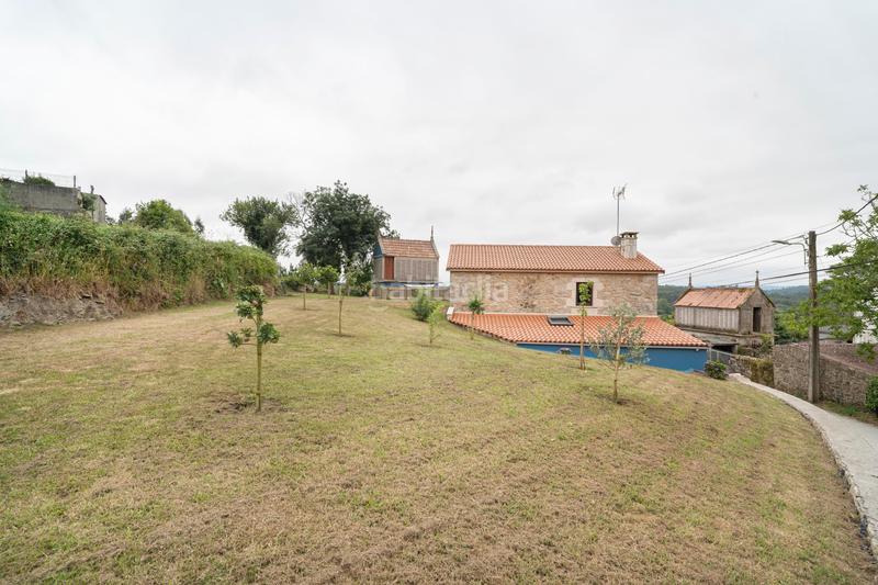 Foto dd8e387c-c8b5-4ffa-8d31-b122ef0c7c00. Casa  de piedra rehabilitada próxima a la playa de razo en Carballo