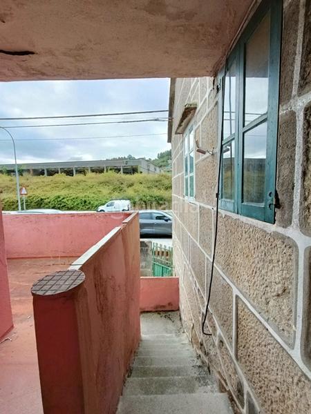 Foto c160bd7f-c4b0-4b74-9592-406d490d5b0e. Casa aparellada a Coruxo - Oia - Saiáns Vigo