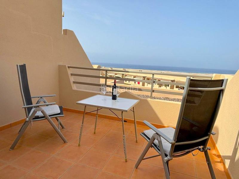 Foto 3127548a-dee1-404f-8137-0d96564103ea. Dúplex  con terraza, vistas al mar y piscina, a solo 20 metros de la playa de la tejita en Granadilla de Abona