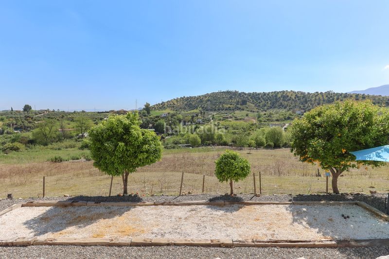Foto a81c1cf4-e851-4980-938d-92d2f32555db. Casa amb xemeneia aparcament piscina a Coín