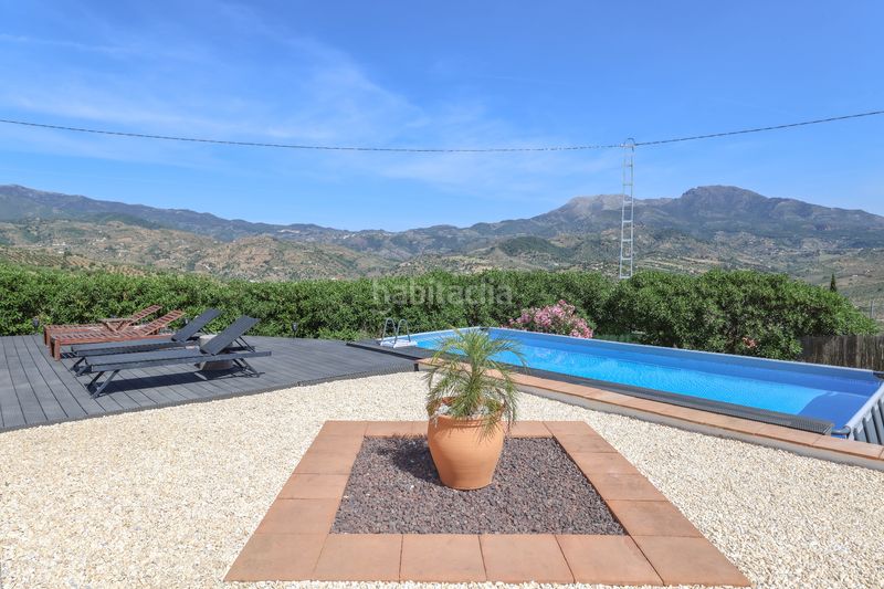 Foto 61d6899c-78d8-442e-b595-ab8b928ec336. Casa amb xemeneia aparcament piscina a Tolox