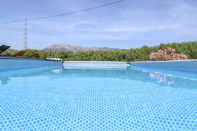 Foto 6aeb4d86-313c-4774-add6-76570d6da226. Casa amb xemeneia aparcament piscina a Tolox