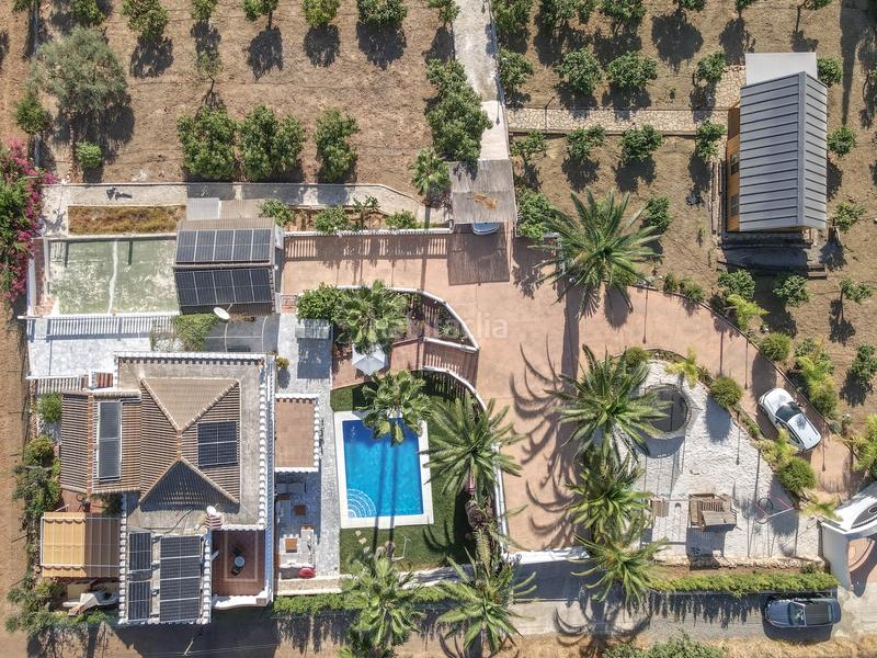 Foto b1fd2fe8-a1a9-4b33-b121-538023e33c31. Chalet avec cheminée parking piscine dans Centro Alhaurín el Grande