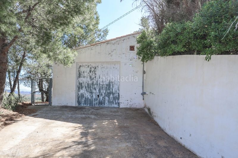 Foto b21239b1-ad56-415b-b8df-5a130ab998bc. Casa amb xemeneia aparcament piscina a Guaro