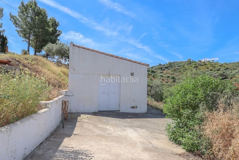 Foto d8ae32f9-ce54-4108-8984-61db62f8ce78. Casa amb xemeneia aparcament piscina a Guaro