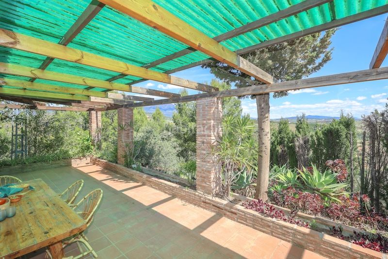Foto dac673b7-d55e-4728-a07c-11d79ef4b397. Casa amb xemeneia aparcament piscina a Guaro