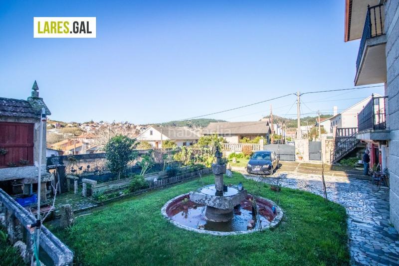 Foto bbcf043b-67e3-4766-a2c8-04559e8afbee. Casa amplia casa de piedra a la venta en Darbo Cangas