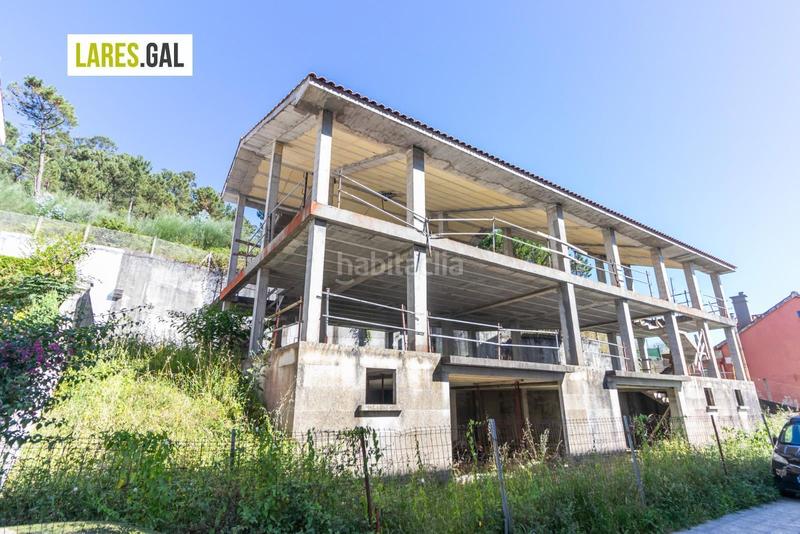 Foto 57aed734-7c4d-40fe-8300-4323697e4670. Casa a schiera con riscaldamento parcheggio in O Hío Cangas