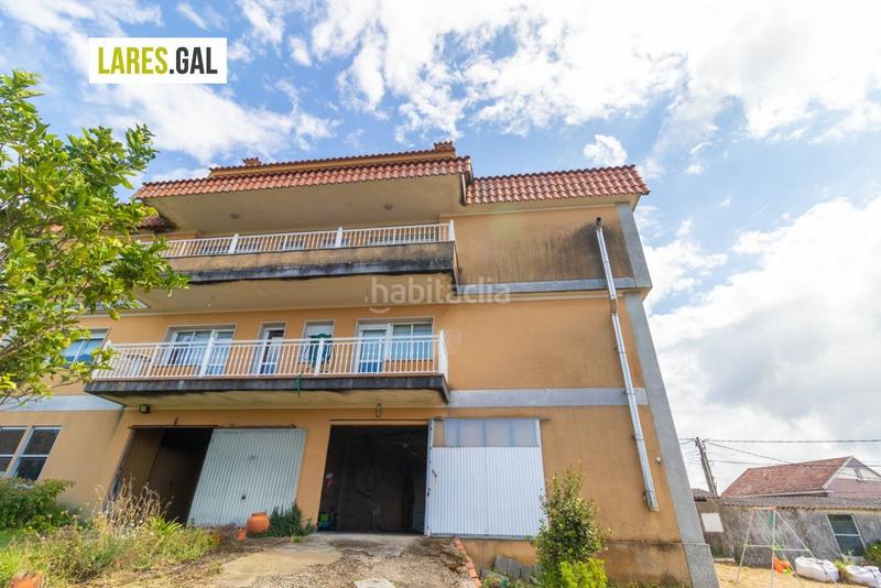 Foto 2587a291-2694-4af0-8a12-625f2a816776. Casa adosada adosado en san roque con terrazas y vistas en Cangas