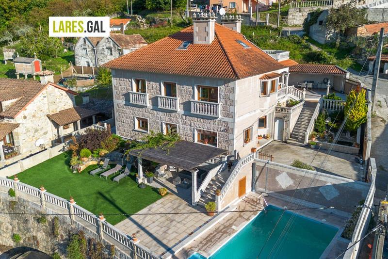 Foto 5133f007-acb4-4f9e-a8b0-341e7c62f62e. Chalet con riscaldamento piscina in Moaña