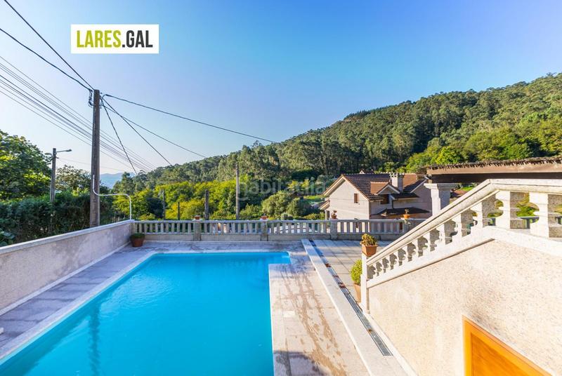 Foto c0d24eff-003b-41e9-9443-a028652507b1. Chalet con riscaldamento piscina in Moaña