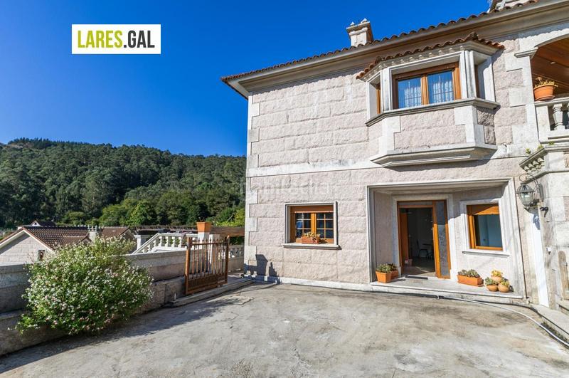Foto e8662b55-a0e0-477a-8547-d169103f62ec. Chalet con riscaldamento piscina in Moaña