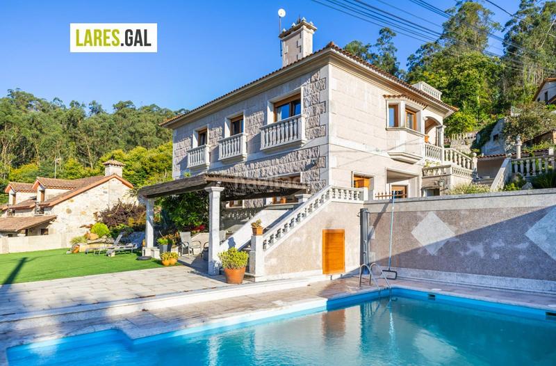 Foto e8e983fd-c524-46b4-95b7-42c9557c7953. Chalet con riscaldamento piscina in Moaña