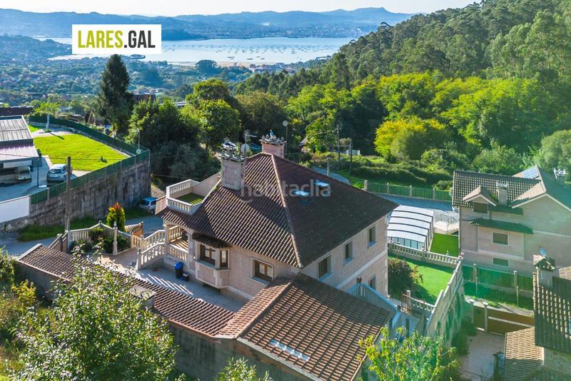 Foto ed40c63e-0d1b-40c0-a74e-ecd153b6a677. Chalet con riscaldamento piscina in Moaña