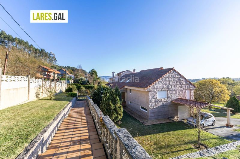 Foto 52de9854-e81a-4f73-9fa8-7e68f2010642. Chalet casa de piedra en serra poñente con jardín en Cangas