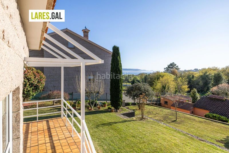 Foto d2f2df6f-e54d-4bb4-9c16-9d437e46cdff. Chalet casa de piedra en serra poñente con jardín en Cangas