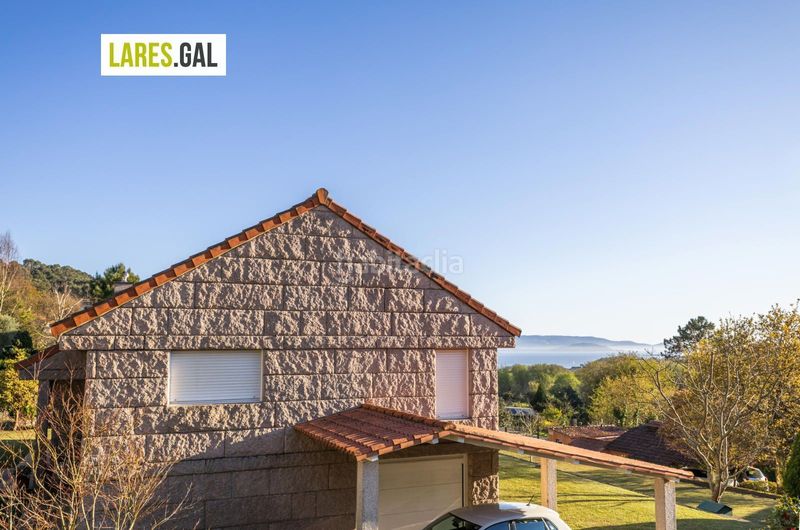 Foto ec4ef967-d08f-4ffc-9884-67c8e8edf50c. Chalet casa de piedra en serra poñente con jardín en Cangas