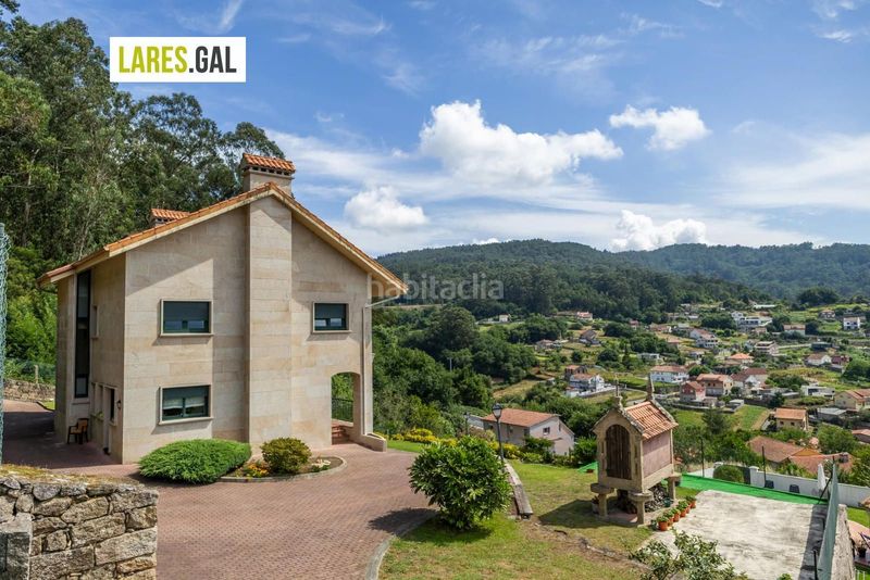 Foto 8f173b2f-343e-4ac0-9b33-298d2ee17284. Casa amb calefacció aparcament a Darbo Cangas