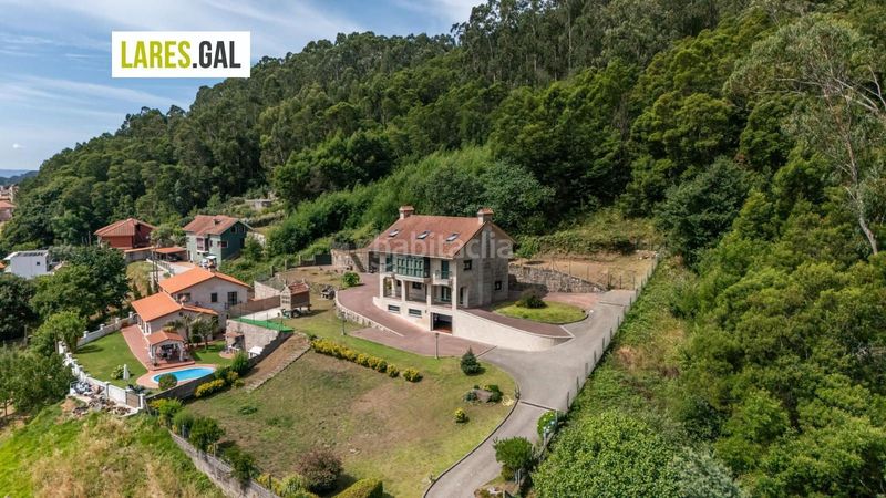 Foto a403e814-019c-432c-9d75-12d939f4b40c. Casa amb calefacció aparcament a Darbo Cangas