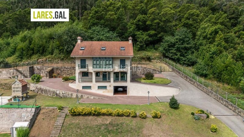 Foto bc1d16d4-2359-458a-8244-fa0130b2331b. Casa amb calefacció aparcament a Darbo Cangas