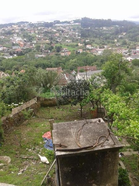 Foto a99c3d31-80a0-4f1f-a920-a4f31a4ad05f. Casa aparellada amb aparcament a Lavadores Vigo