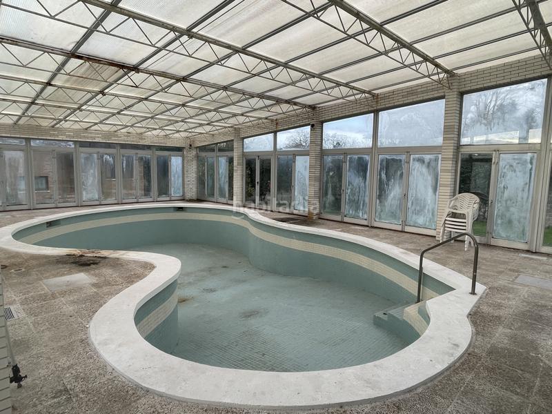 Foto db89e390-8f99-4f56-8259-d1431fe558b0. Casa amb calefacció aparcament piscina a Somió Gijón