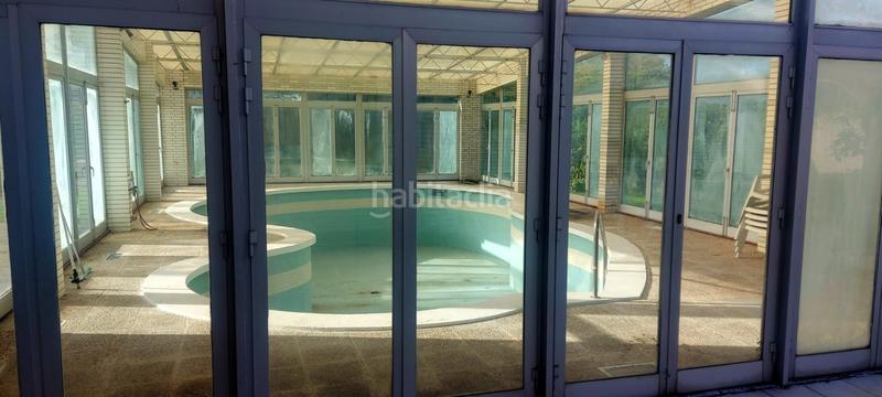 Foto e5956593-c933-4f4a-9777-2b8dd9fea369. Casa amb calefacció aparcament piscina a Somió Gijón