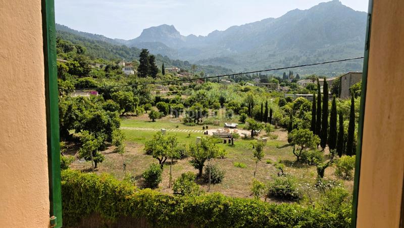 Foto f4979de3-638f-4af9-982f-82362a2ef0d6. Casa pareada casa con jardín en las afueras en Sóller