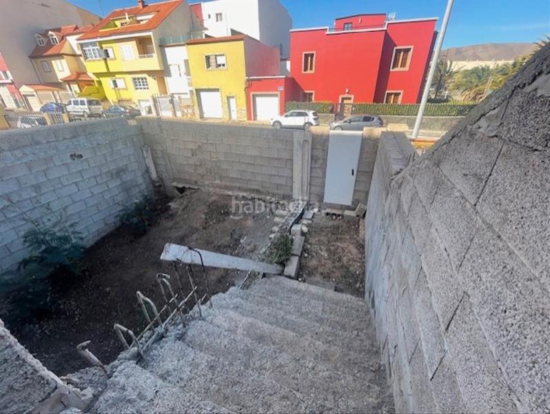 Foto c26858e5-7a04-4f15-a166-38b88805da94. Casa pareada vecindario. chalet pareado en venta, en zona residencial. para terminar. en Santa Lucía de Tirajana