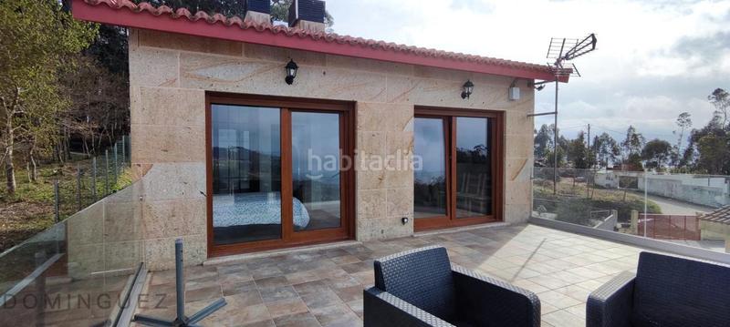 Foto 439d509e-f854-4210-a2c4-0861311de5c7. Casa amb calefacció aparcament piscina a Dorrón Sanxenxo