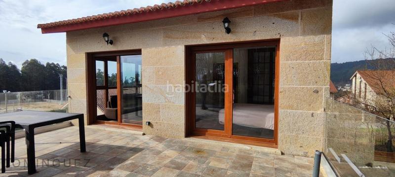 Foto 7e97391a-5c18-4980-bfea-9d270a1ab4ee. Casa amb calefacció aparcament piscina a Dorrón Sanxenxo