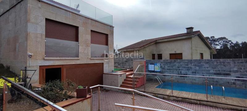 Foto c9216c9e-53f9-4c6c-a0ce-aec7eff1bc2f. Casa amb calefacció aparcament piscina a Dorrón Sanxenxo