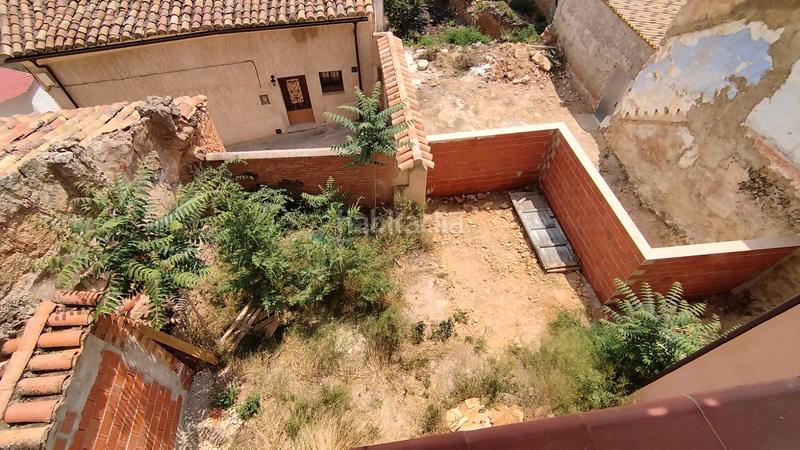 Foto a9565a96-1308-4fc8-960e-9dccff506041. Casa pareada casa de pueblo con dos escaleras 300m2 en Castielfabib