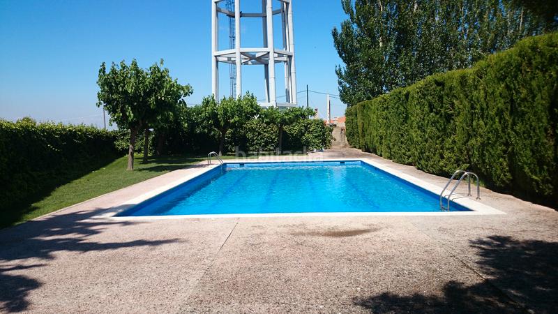 Foto cd010e44-609c-4a8f-963e-e89a35f40de8. Xalet amb xemeneia calefacció aparcament piscina a Ainzón