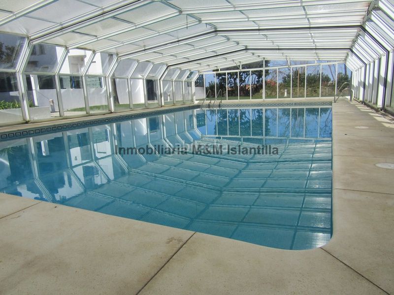 Foto 5b6d1384-171f-4278-a072-f482bd4dadf3. Casa adossada amb aparcament piscina a Islantilla golf Islantilla