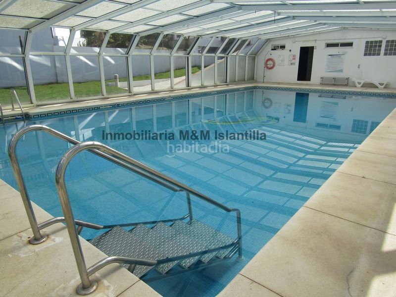 Foto f1bf86bb-1693-4227-9664-edcb0375e3a3. Casa adossada amb aparcament piscina a Islantilla golf Islantilla